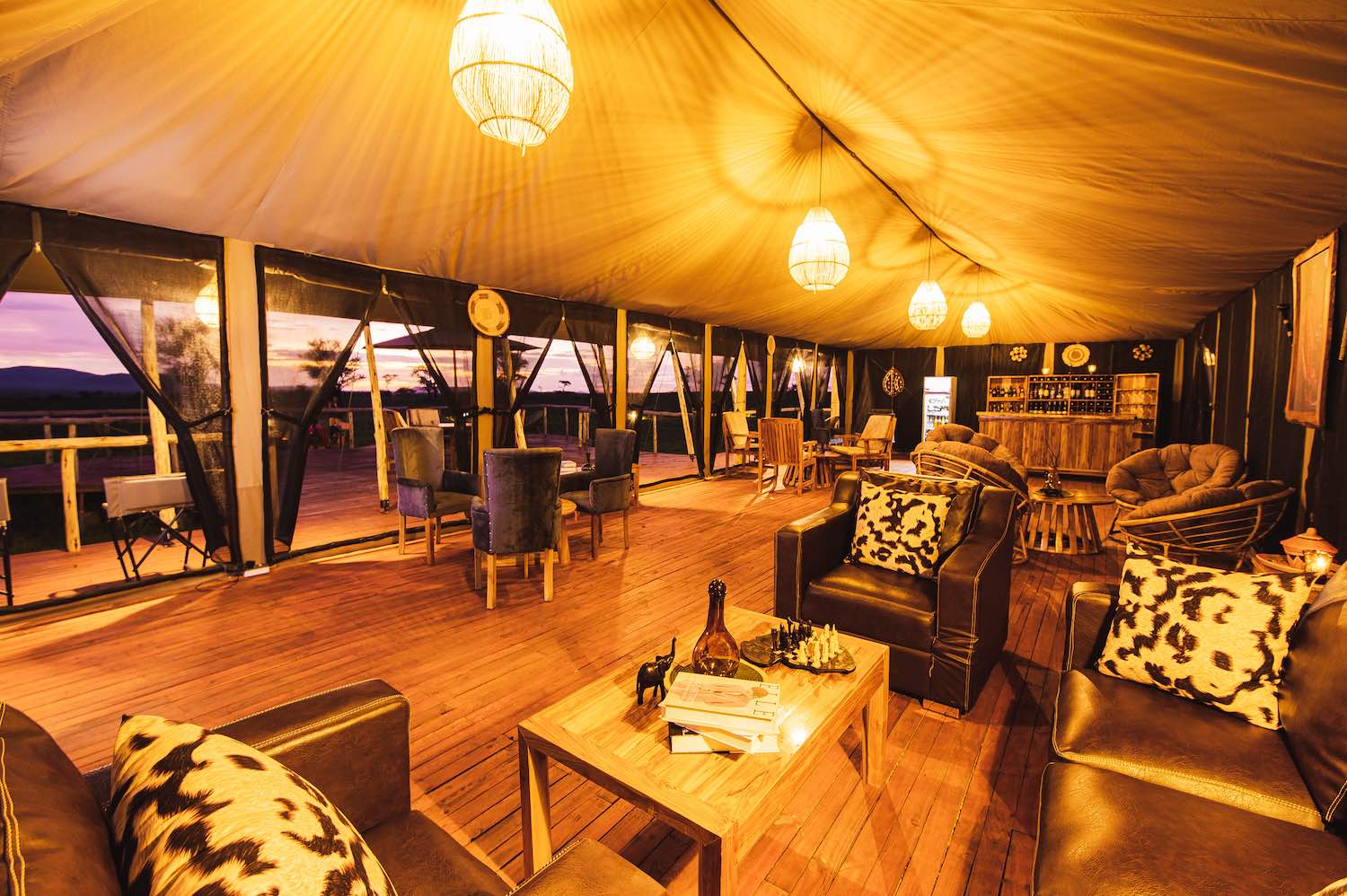 Large communal tent with bar and panoramic windows