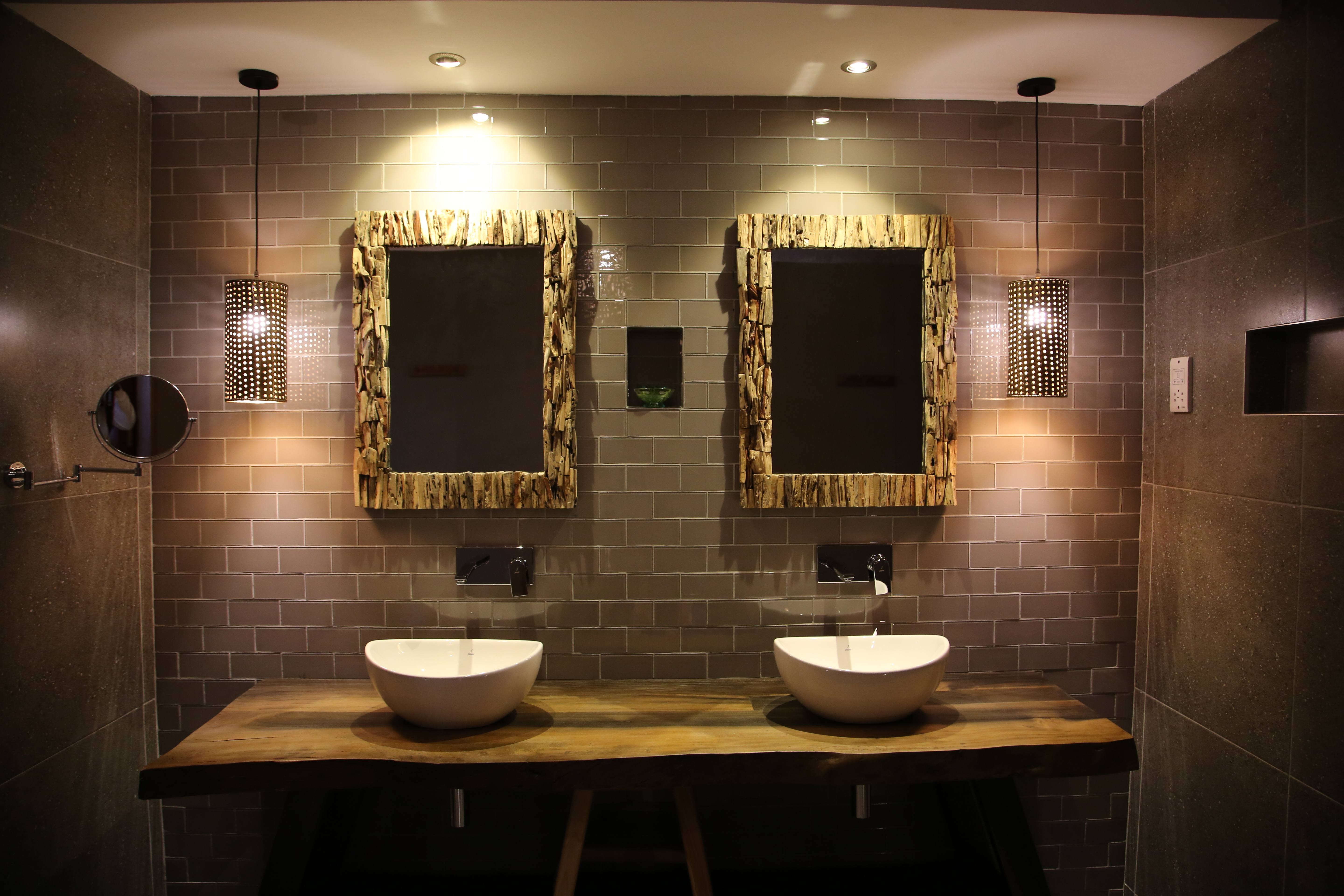 Modern bathroom with dual vessel sinks and subway tile walls