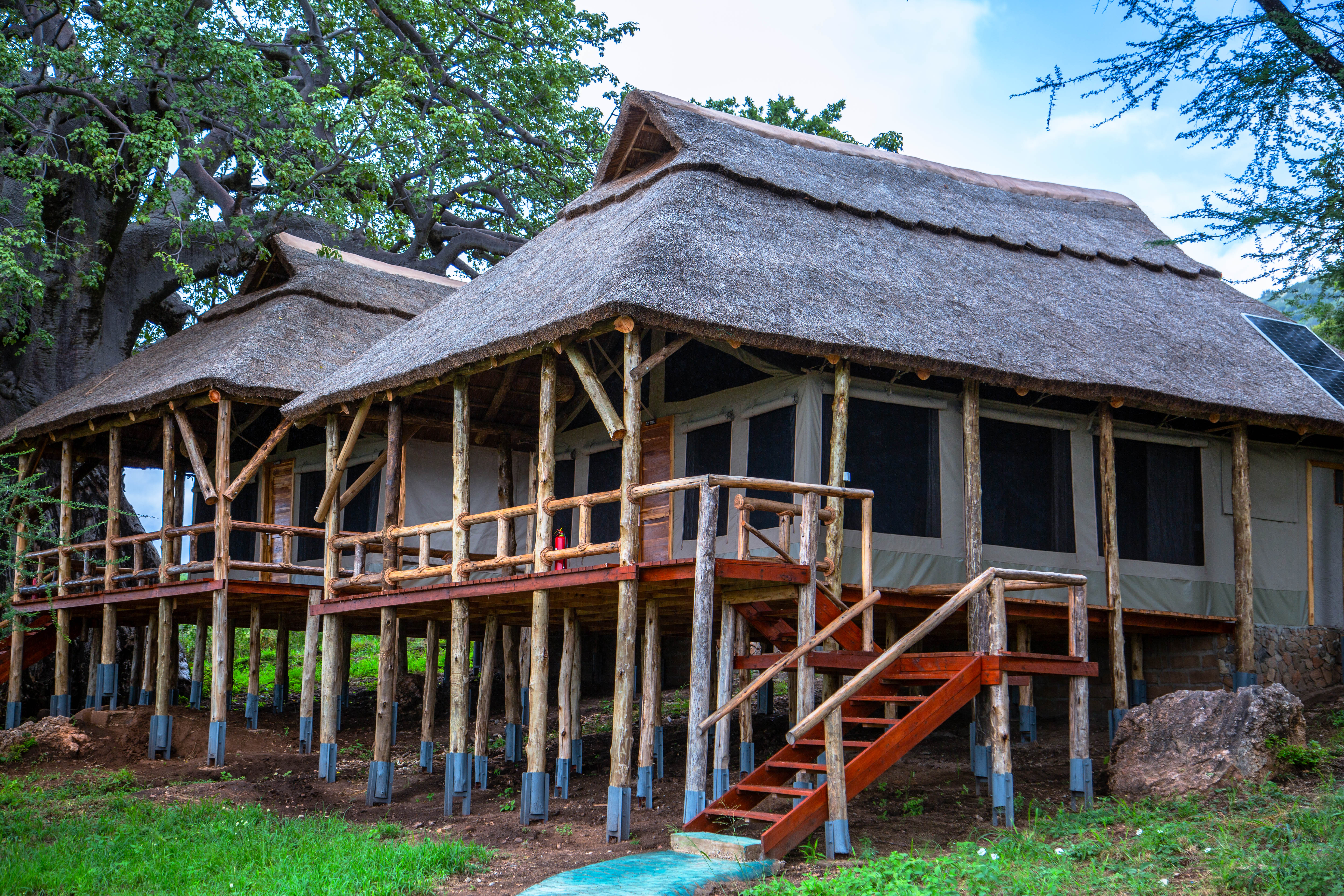 Elevated thatched-roof lodge structure