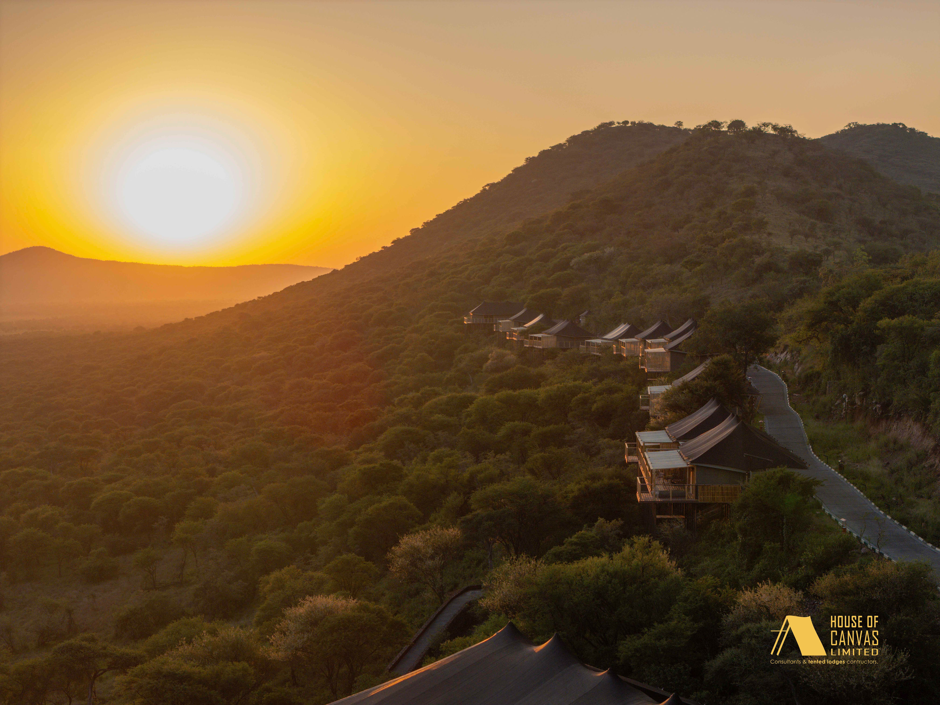 Aerial view of safari camp at twilight