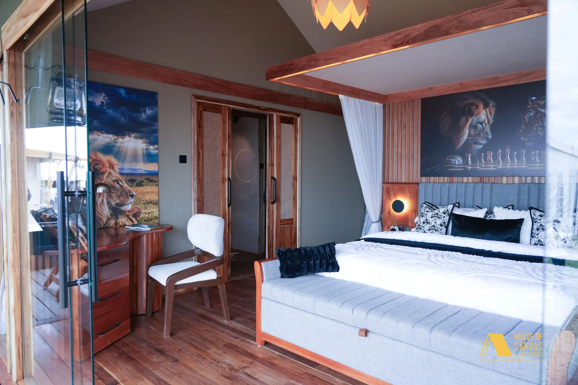 Bedroom suite at Kili Fair 2026 with glass entry and writing chair